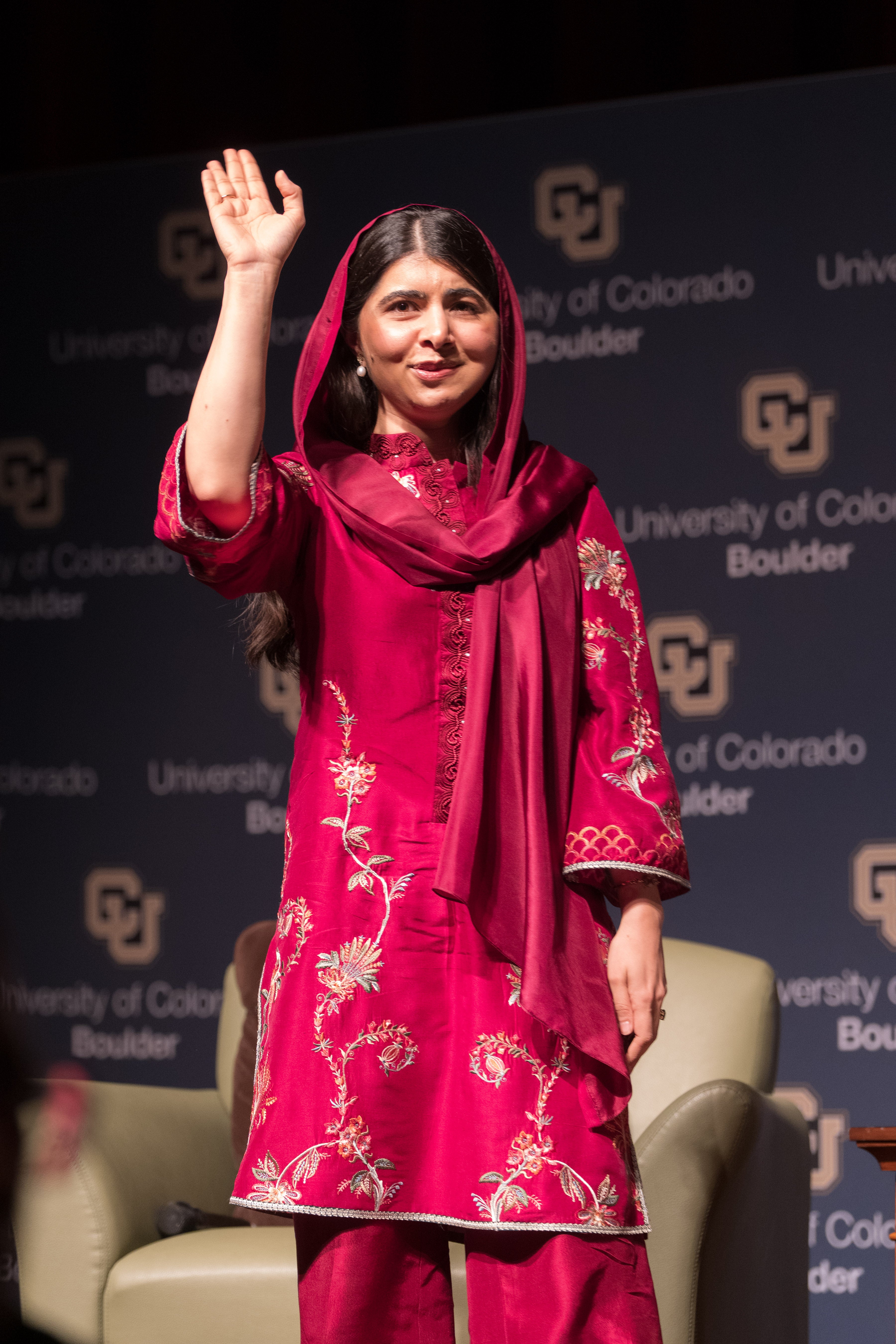 Keynote speaker Malala Yousafzai waves at the crowd