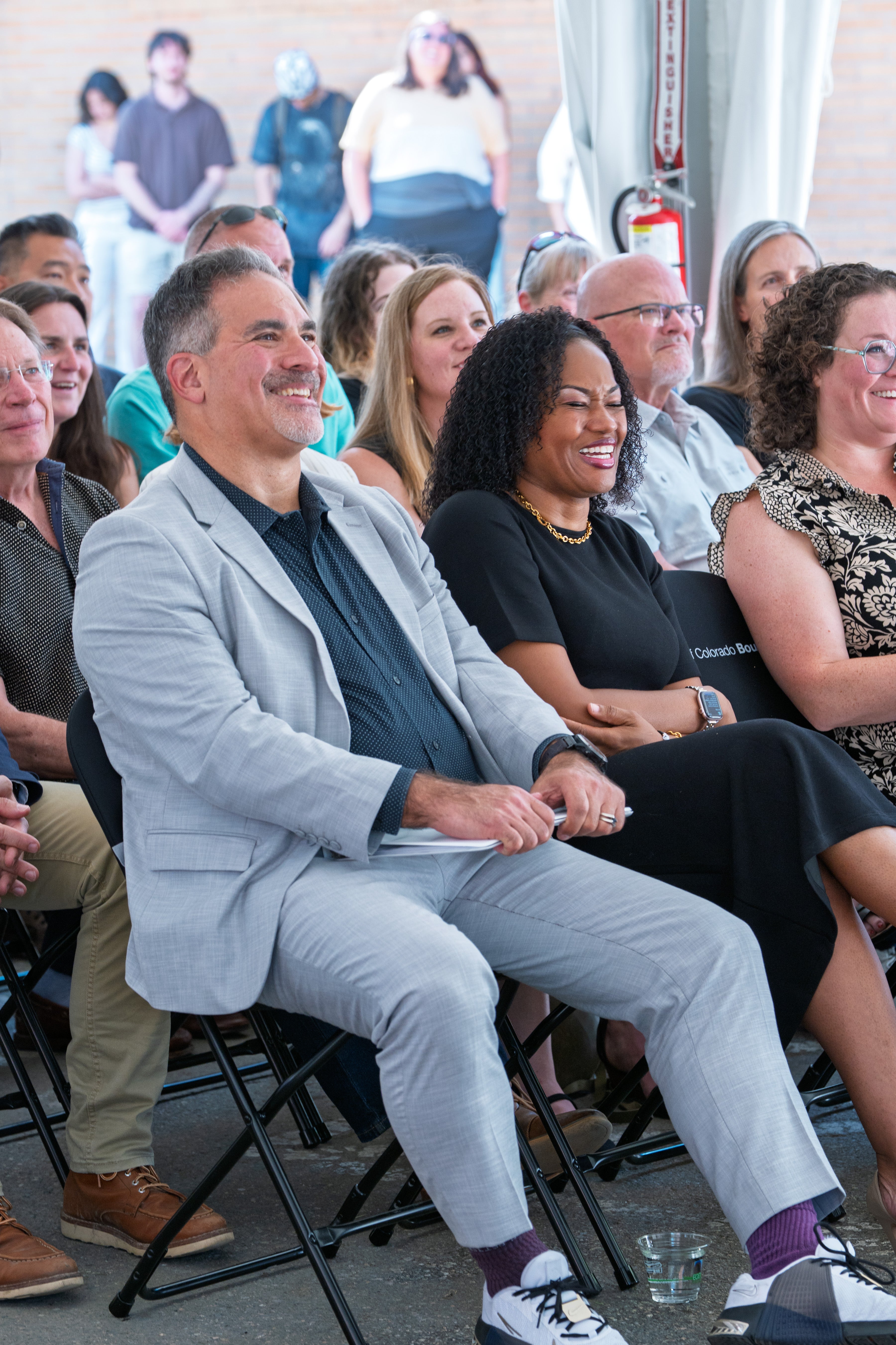 Chancellor Justin Schwartz and Vice Chancellor D’Andra Mull react during a light moment at a dedication ceremony.