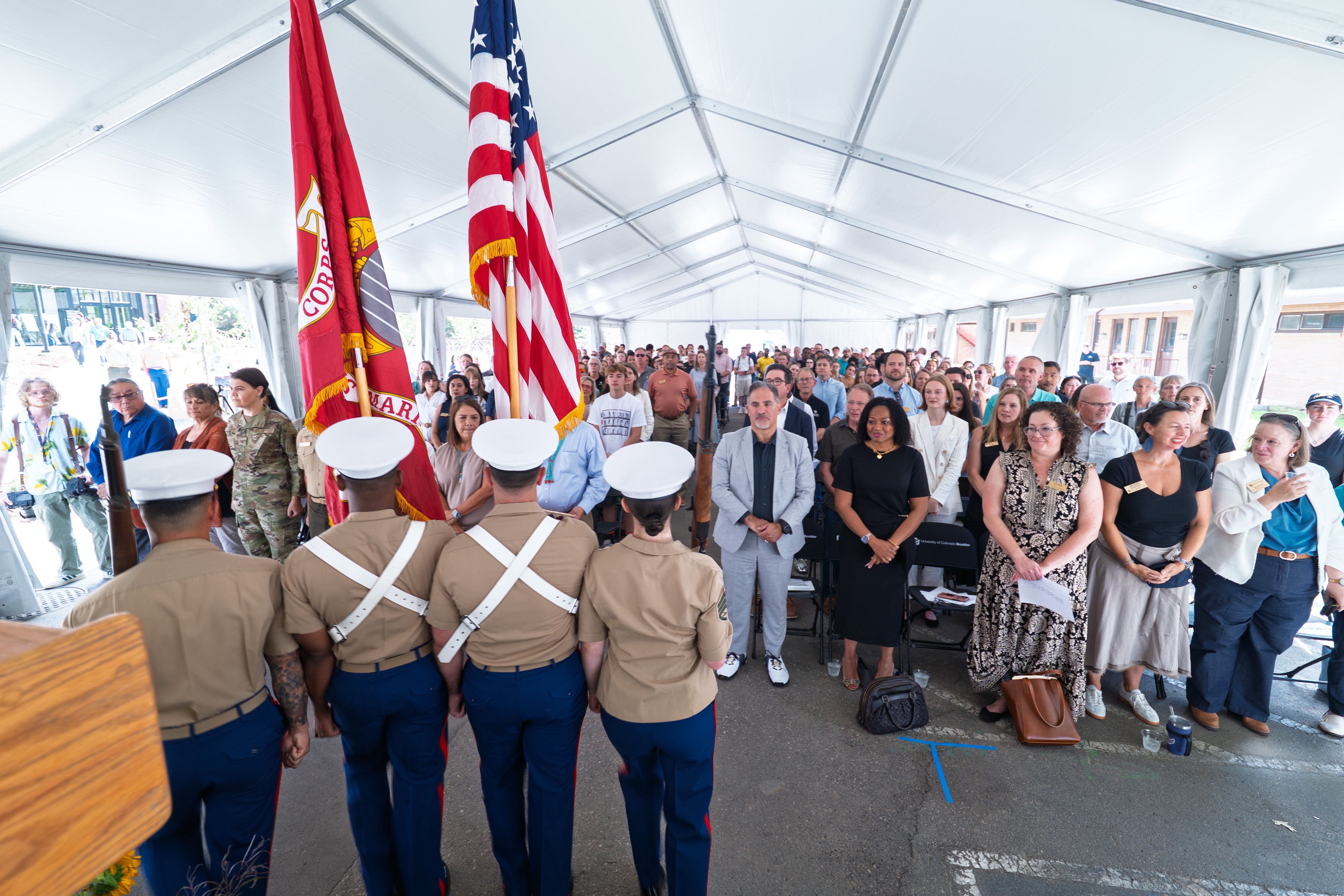 Participants watch the color guard during the Code Talker Hall residence hall dedication ceremonies.