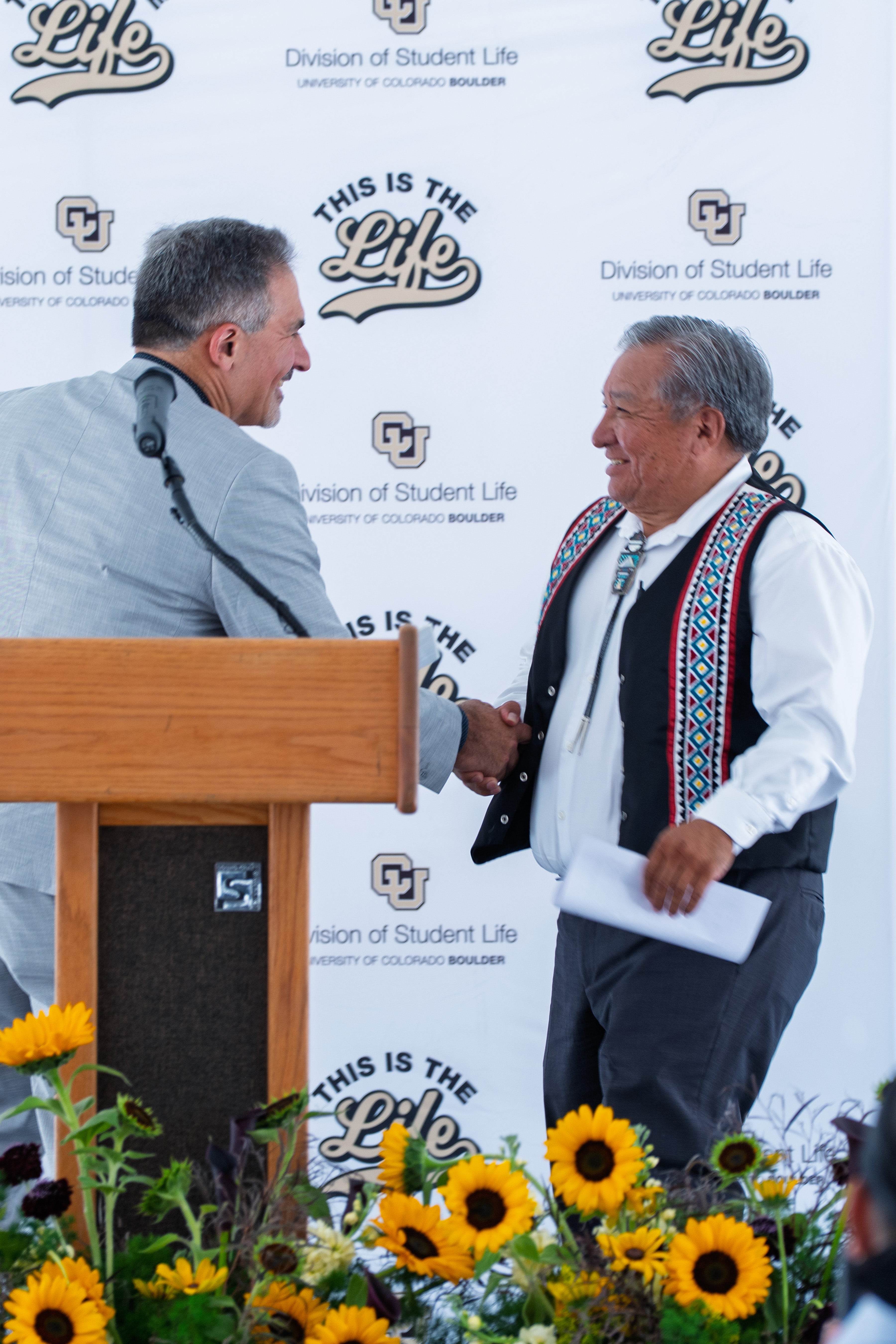 Chancellor Justin Schwartz introduces Bennie Shendo, associate vice chancellor for Native American affairs, during a dedication ceremony.
