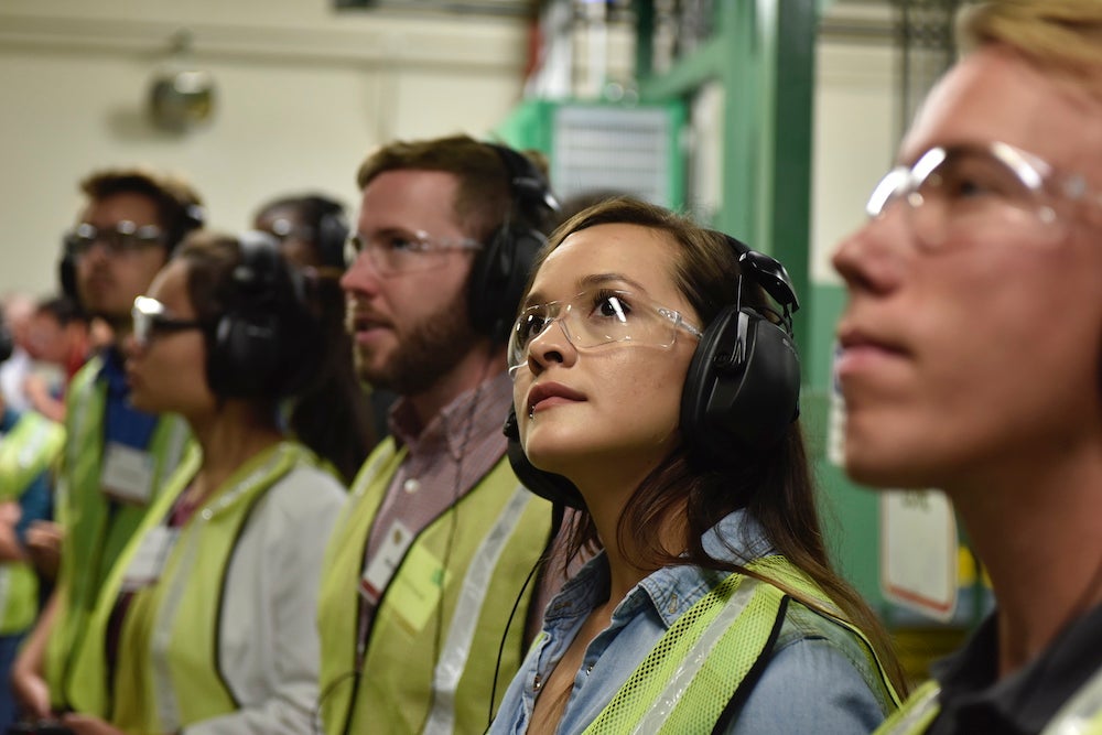 A CU Boulder student tours the high-speed beverage can manufacturing facilities in Golden during Ball Cooperation Career Day, 2018. 