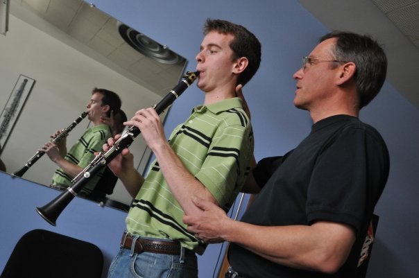 Professor Jim Brody instructs a student-musician