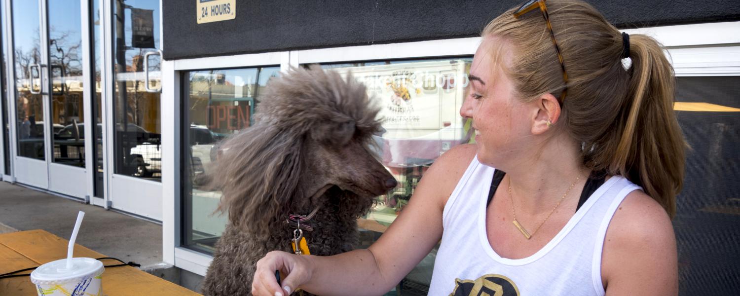 Grad student Clare Bradley takes lunch break with her standard poodle