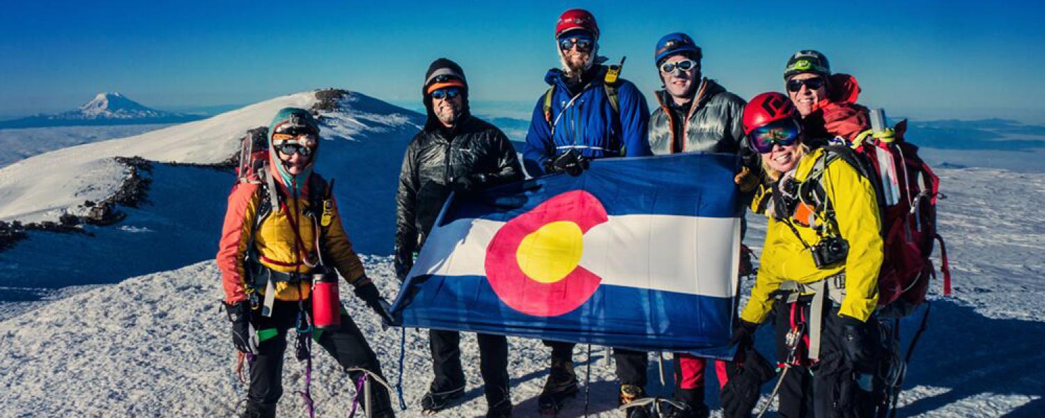 The Colorado Mountain Club, pictured on a summit, is funded in part by CCC donations