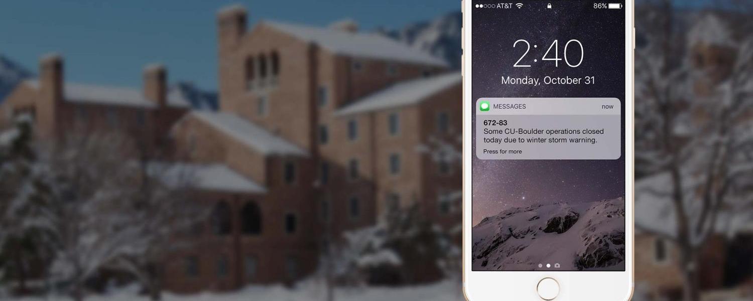 Image of phone showing an alert, over a snowy background
