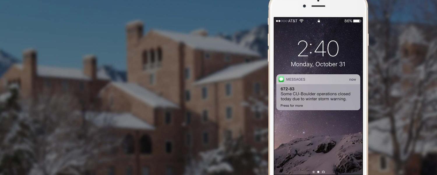 Image of phone showing an alert, over a snowy background