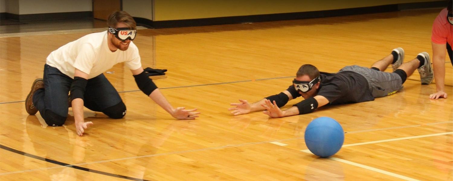 Two players in eyeshades play goalball