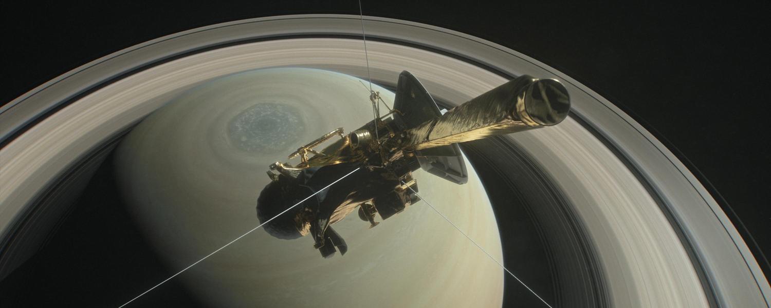 The Cassini spacecraft flies over Saturn