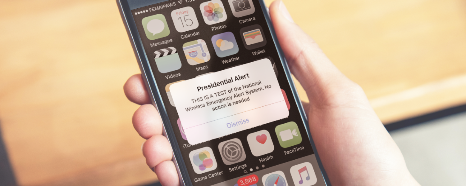 Image of a presidential emergency alert displayed on a cell phone