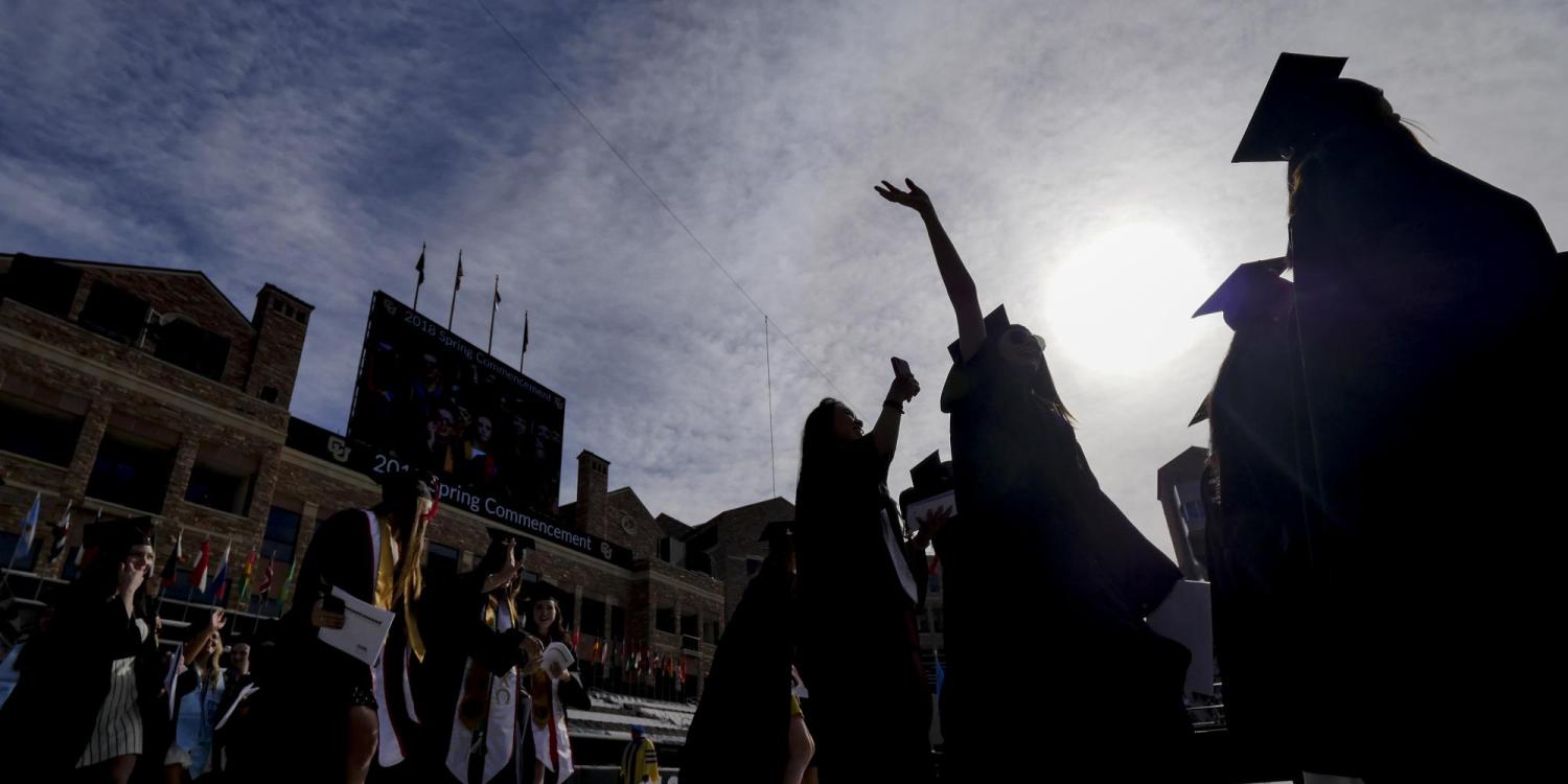 2018 graduates process onto Folsom Field