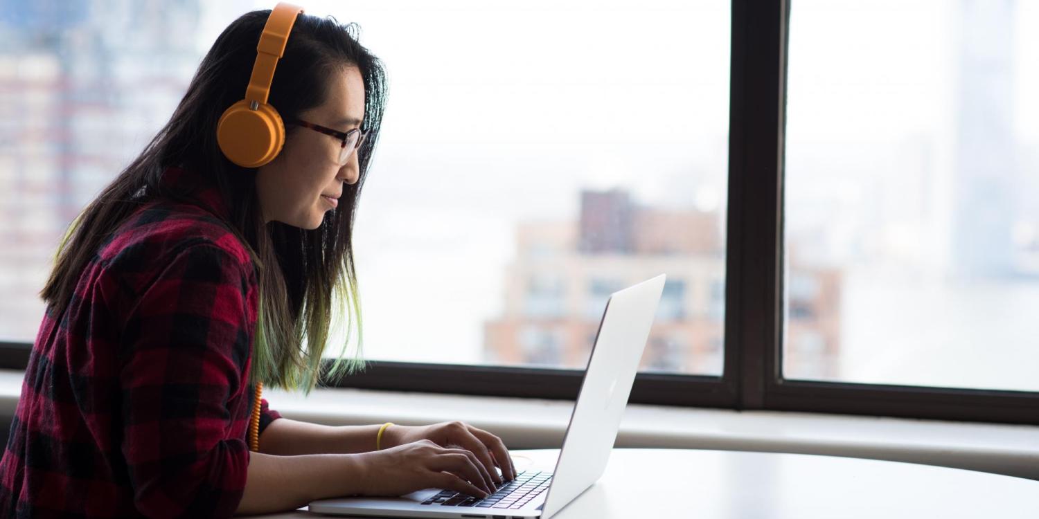 Person sitting at a laptop computer