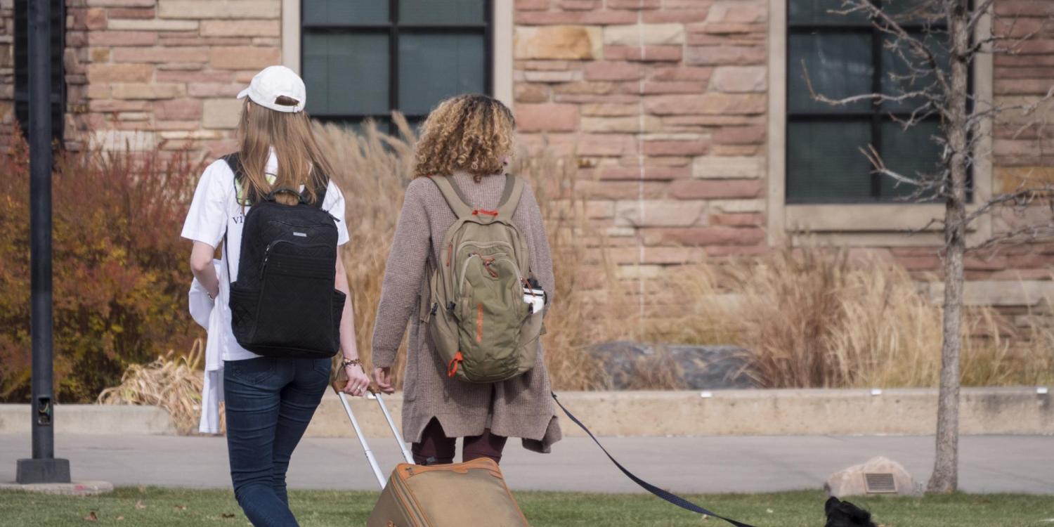 CU Boulder students (and dog) leave for break