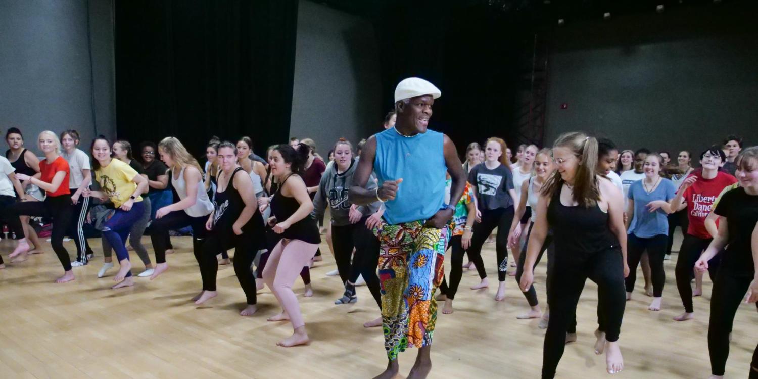 NiiAhmah Sowan leads high school students in African dance at the 2019 High School Dance Day at the CU Boulder campus. (Photo by Glenn Asakawa/University of Colorado)