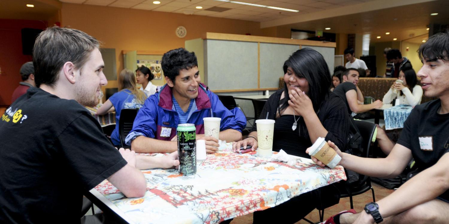 Students chat over coffee and snacks at the weekly International Coffee Hour event