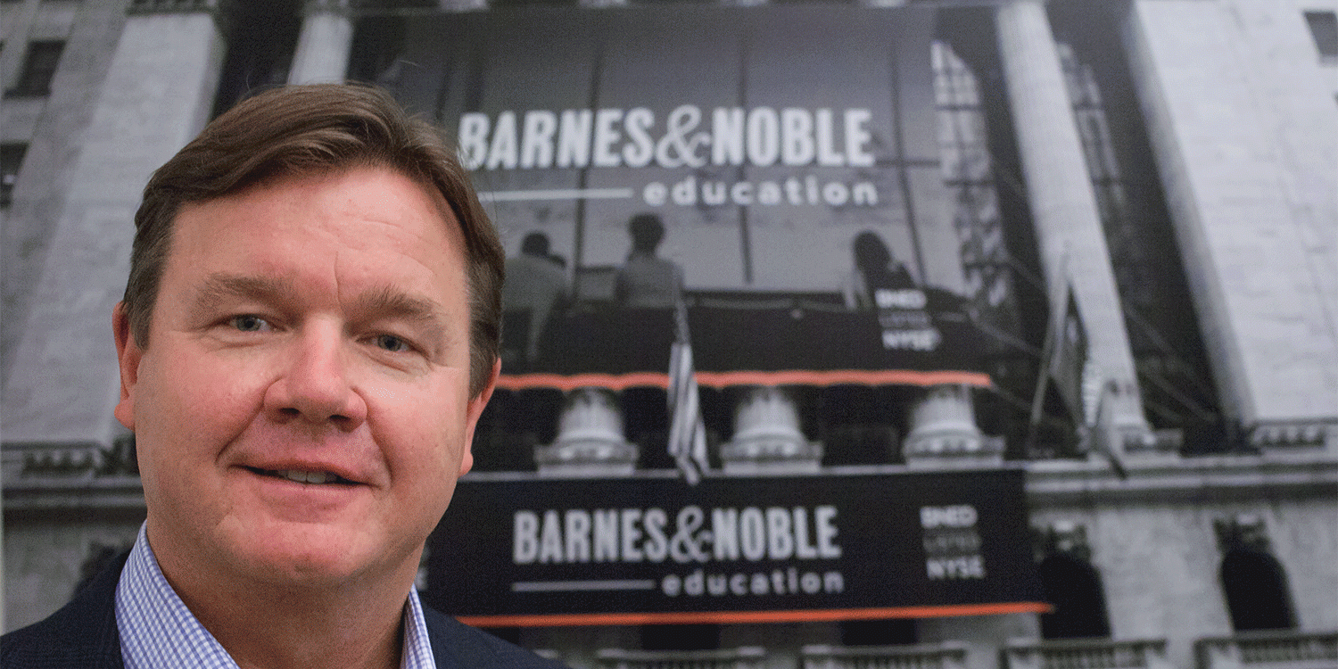 Michael Huseby stands in front of Barnes & Noble Education storefront