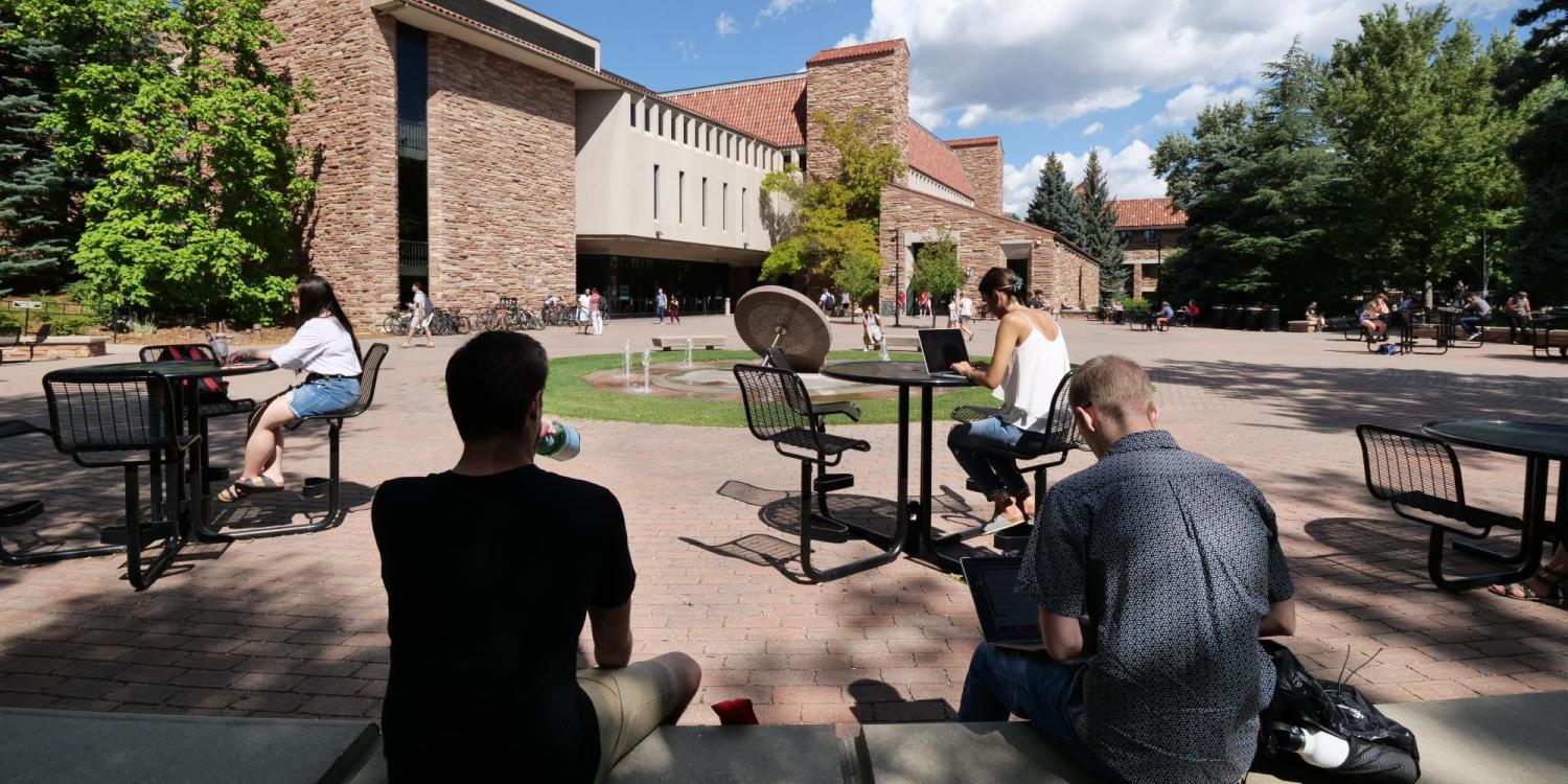 Students studying near Norlin fountain