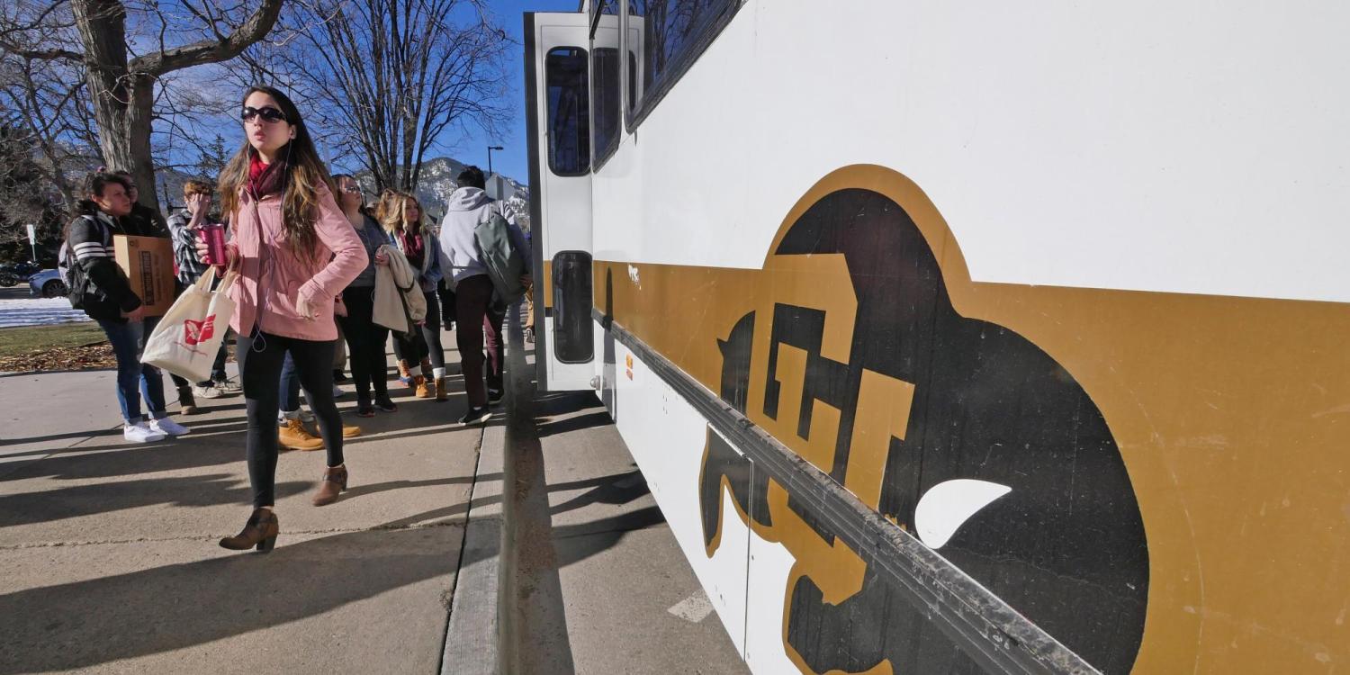 People step off the Buff Bus on the first day back from winter break. Photo by Casey A. Cass.