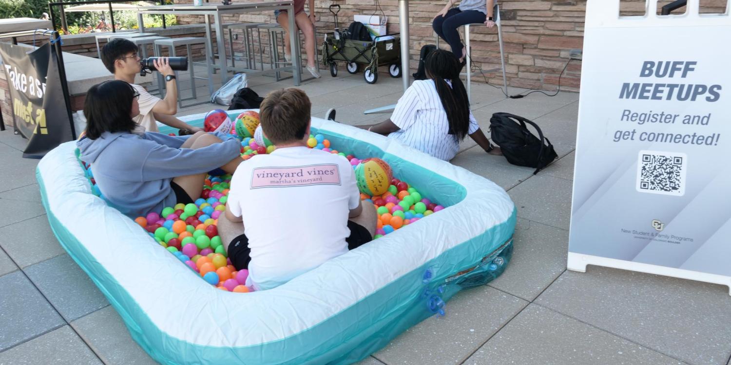Students sitting in a ball pit at the Take a Seat, Meet a Buff event