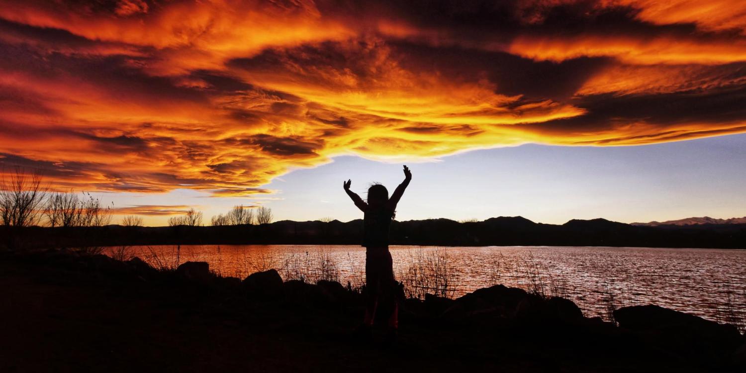 Silhouette of a person near Waneka Lake at sunset