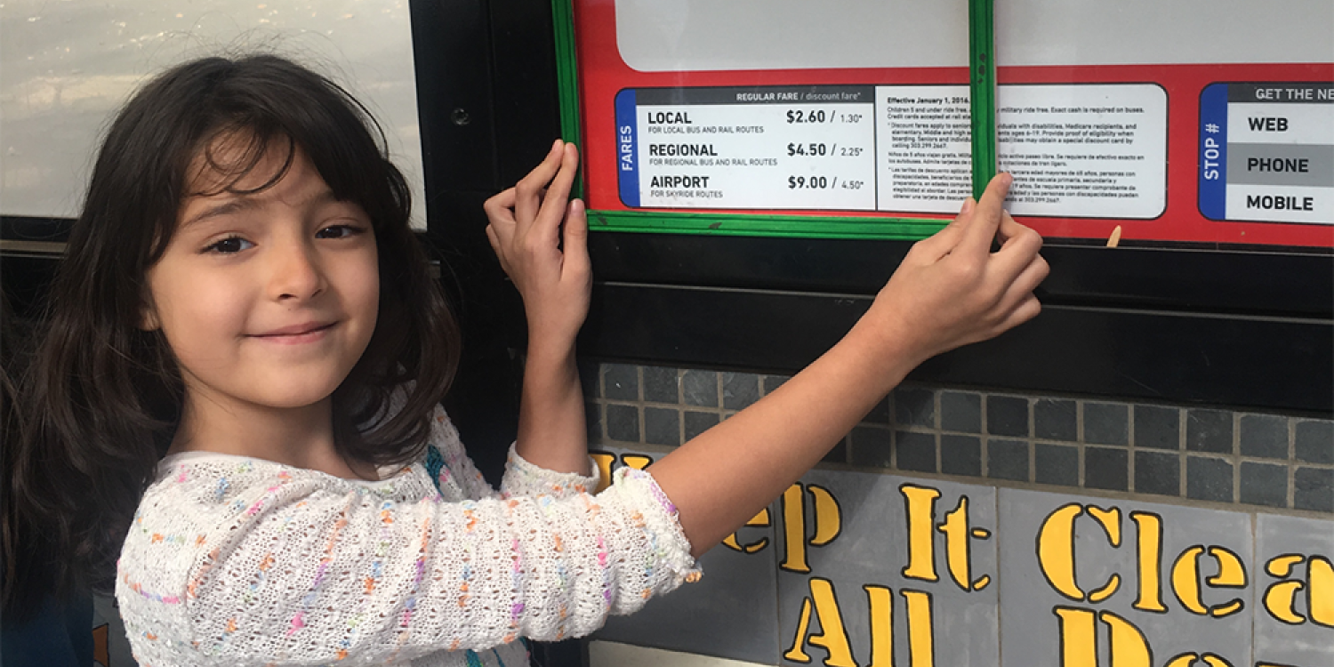 A Whittier Elementary School student uses a green frame to show that she likes the sign being low enough for children to read it. Students used green and red frames to frame the things they liked and didn’t like about the HOP.