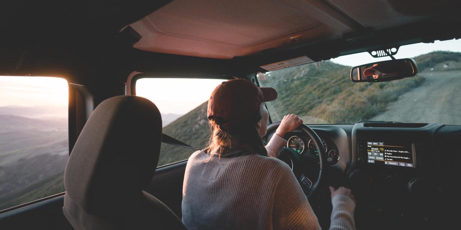 person driving in the mountains