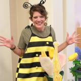 An instructor dressed in a bee costume