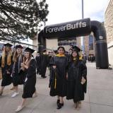 CU Boulder graduates attending commencement ceremony