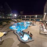 Students swimming in the Buff pool at night