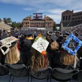 Decorated graduation caps during ceremony