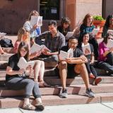 People reading on the steps of Norlin Library