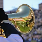 Gold Buff Marching Band member plays marching euphonium during Homecoming game