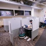 Students wear masks and stay socially distanced in a study area in Norlin Library 