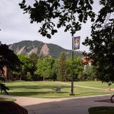 A view of the Flatirons from a quiet CU Boulder campus.