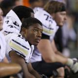 Michael Adkins watches from the sidelines