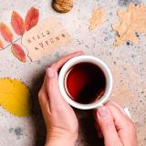 person holding a cup of tea