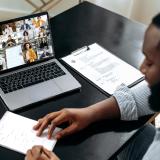 a Black person participating in a virtual meeting