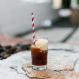 root beer float with ice cream and a red striped paper straw