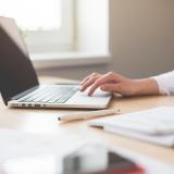 Professional woman works on laptop