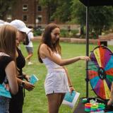 Student spinning a wheel at the Be Involved Fair