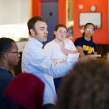 Ben Kirshner works with group of students