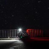 Bike with front light and rear reflector at night