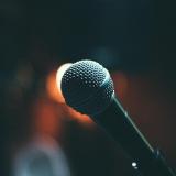 Close-up photo of a microphone on stage