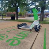 Lime Scooters are parked near Williams Village