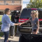 Boulder City Manager Jane Brautigam, left, greets Kim Ward of Lake Forest, IL, during move-in