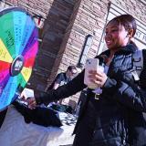Student spinning a prize wheel at the Buffs All-in Giving Day