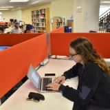 Students at computers in Business Library