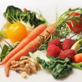 Spread of carrots, tomatoes, greens, walnuts and raspberries