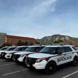 CU Boulder police cars with Flatirons in the background