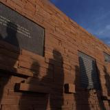 Visitors file by the inscribed plaques on the outer circle of the Columbine Memorial at Clement Park. Credit: Glenn Asakawa