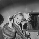 Christine Jorgenson in the back of a vehicle